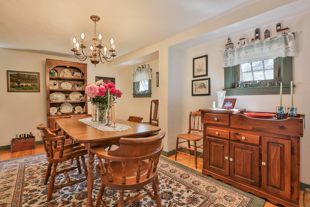 129 Gleason Road Princeton, MA 01541 - Photo 23 of 30 a view of a dining room with furniture and chandelier