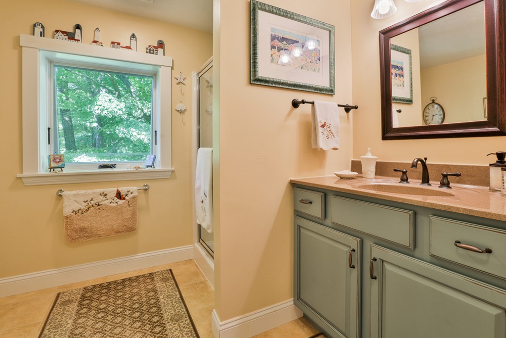 129 Gleason Road Princeton, MA 01541 - Photo 27 of 30 a bathroom with a sink and a window