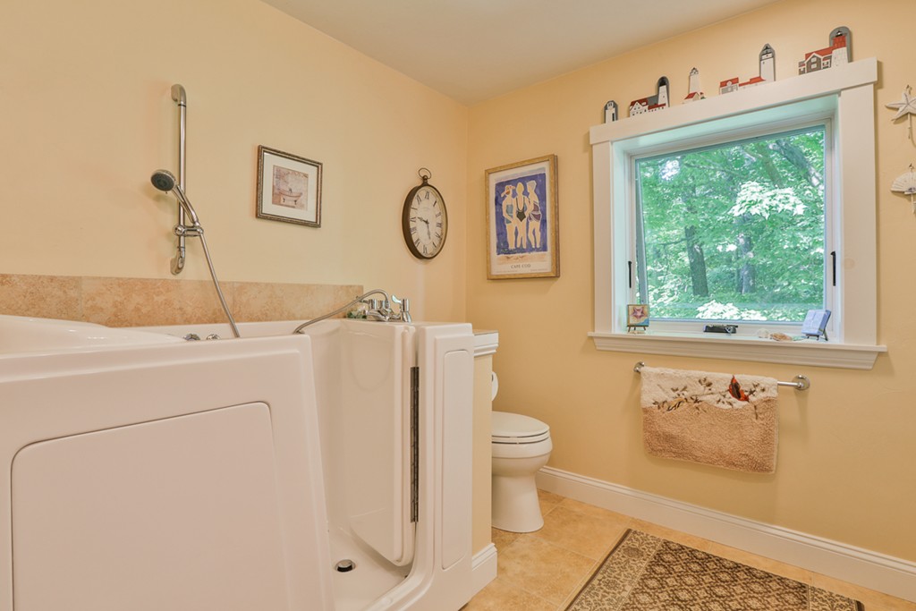 129 Gleason Road Princeton, MA 01541 - Photo 28 of 30 a bathroom with a sink toilet and mirror