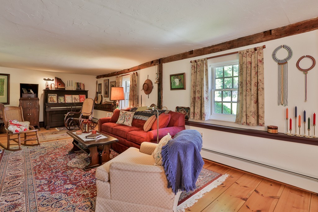 129 Gleason Road Princeton, MA 01541 - Photo 9 of 30 a living room with furniture and large windows