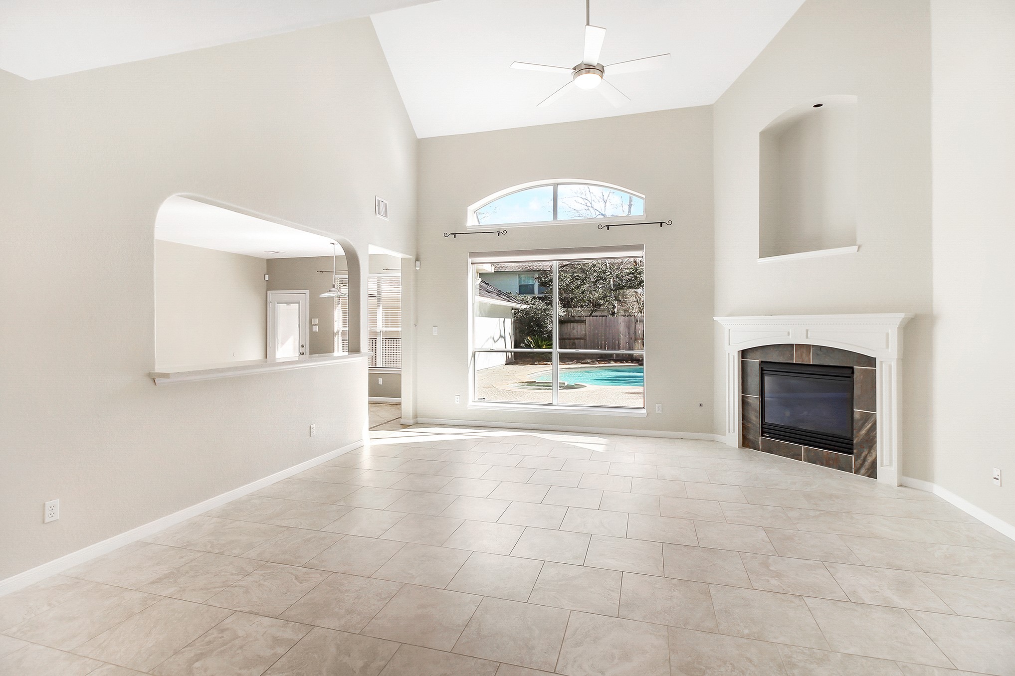 803 Chisel Point Drive Houston, TX 77094 - Photo 10 of 36 Family room with double height ceilings & cozy fireplace.