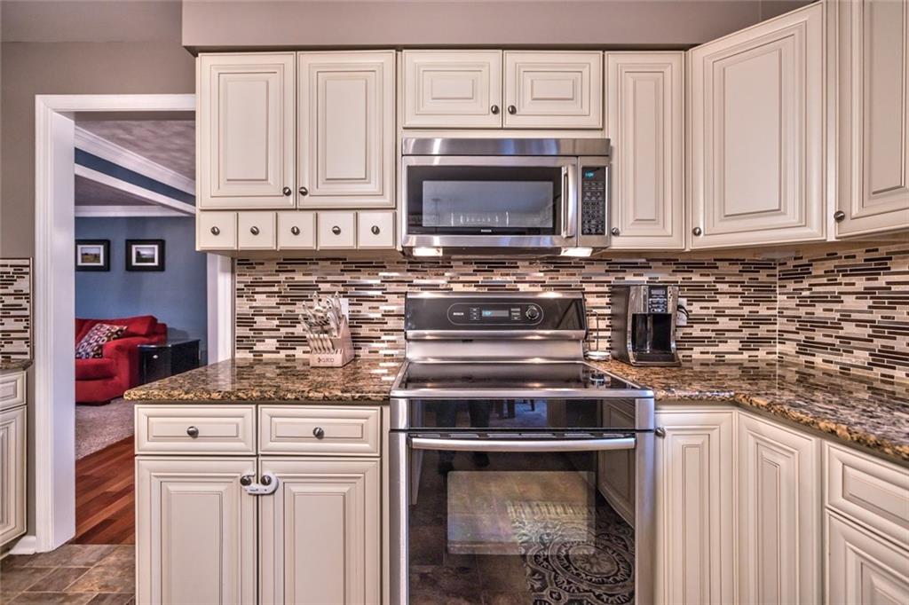 745 Spang Road Baden, PA 15005 - Photo 7 of 25 Custom Ceramic Backsplash, Stainless Oven and Microwave