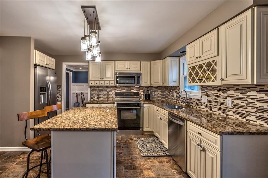 745 Spang Road Baden, PA 15005 - Photo 9 of 25 Dine In Island, Granite Counter, New Light Fixture, New Ceramic Tile Floor