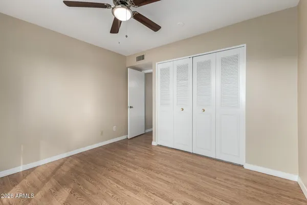 a view of an empty room and wooden floor