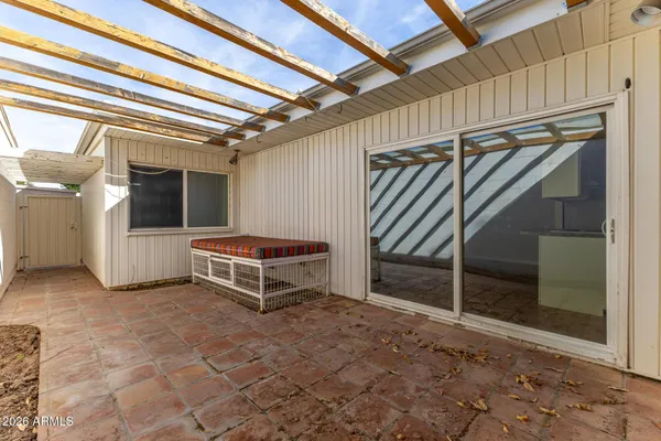a view of a balcony with furniture