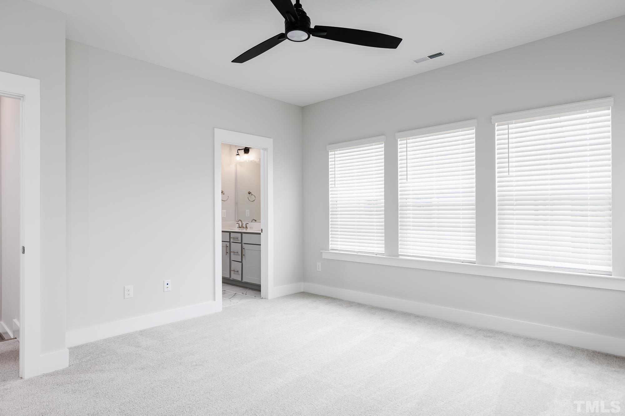 8226 Ebenezer Church Road Raleigh, NC 27613 - Photo 8 of 16 a view of an empty room with a window