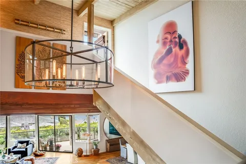 a view of a building with car parked