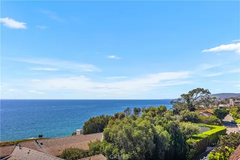 a living room with furniture fireplace and window