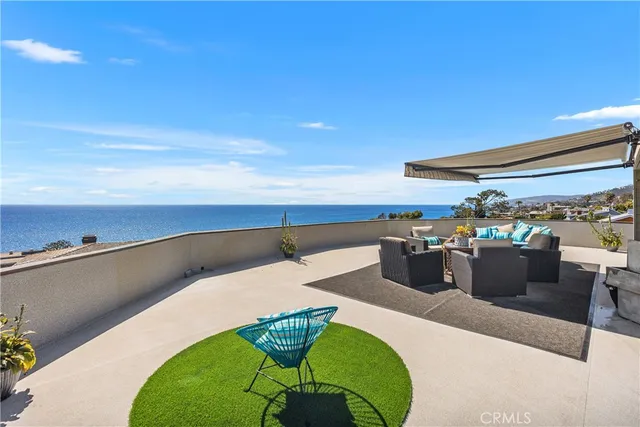 a view of a chairs and table in patio