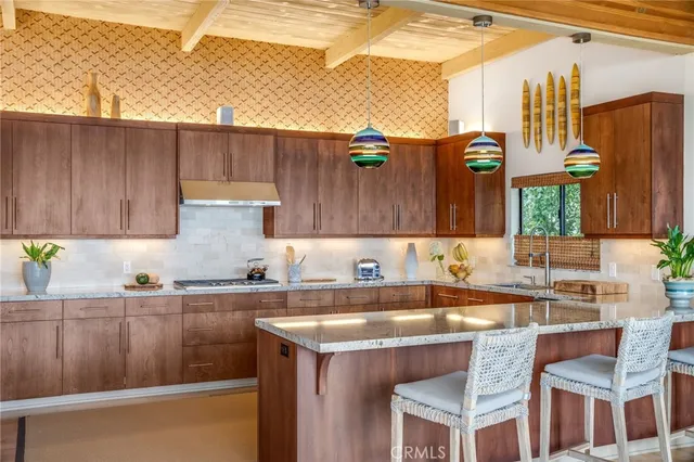 a kitchen with a sink cabinets and window