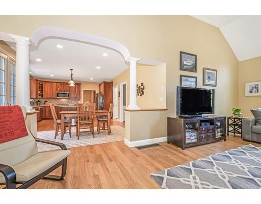 271 Sargent Road Boxborough, MA 01719 - Photo 11 of 29 a living room with furniture and a flat screen tv with kitchen view