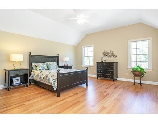 271 Sargent Road Boxborough, MA 01719 - Photo 17 of 29 a bedroom with a bed and a chandelier
