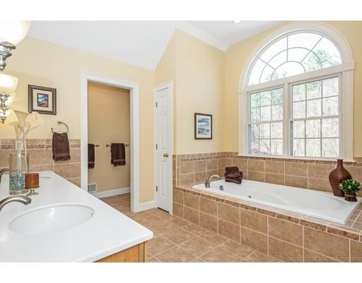 271 Sargent Road Boxborough, MA 01719 - Photo 19 of 29 a bathroom with a tub sink and mirror