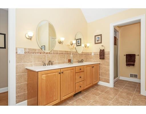 271 Sargent Road Boxborough, MA 01719 - Photo 20 of 29 a bathroom with a double vanity sink a mirror and a shower