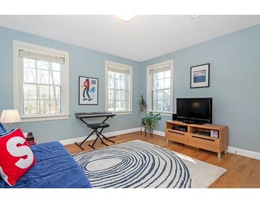 271 Sargent Road Boxborough, MA 01719 - Photo 22 of 29 a living room with furniture a flat screen tv and a window