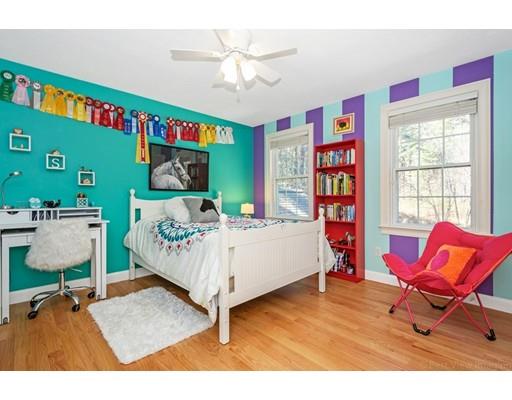 271 Sargent Road Boxborough, MA 01719 - Photo 23 of 29 a bedroom with a bed and a bookshelf