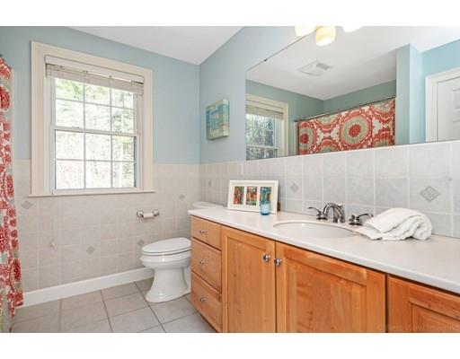 271 Sargent Road Boxborough, MA 01719 - Photo 24 of 29 a bathroom with a sink a toilet and a window