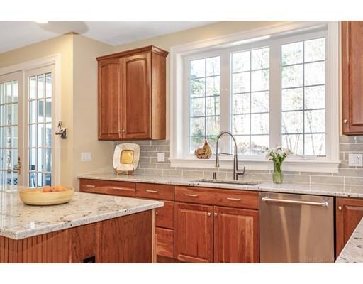 271 Sargent Road Boxborough, MA 01719 - Photo 4 of 29 a kitchen with stainless steel appliances granite countertop a sink a stove cabinets and a counter top space