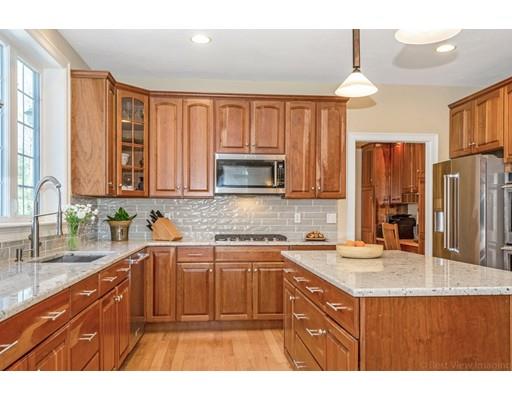 271 Sargent Road Boxborough, MA 01719 - Photo 5 of 29 a kitchen with stainless steel appliances a sink stove and cabinets