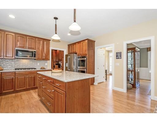 271 Sargent Road Boxborough, MA 01719 - Photo 6 of 29 a kitchen with stainless steel appliances granite countertop a sink refrigerator and cabinets