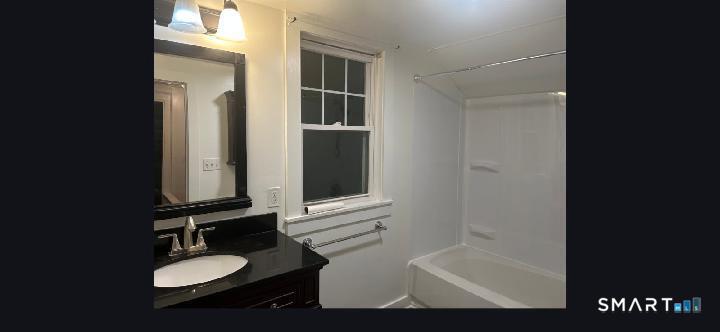 34 Rock Street Winchester, CT 06098 - Photo 18 of 20 a bathroom with a sink and a mirror