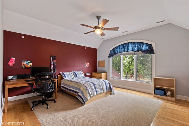 a bedroom with furniture and a window