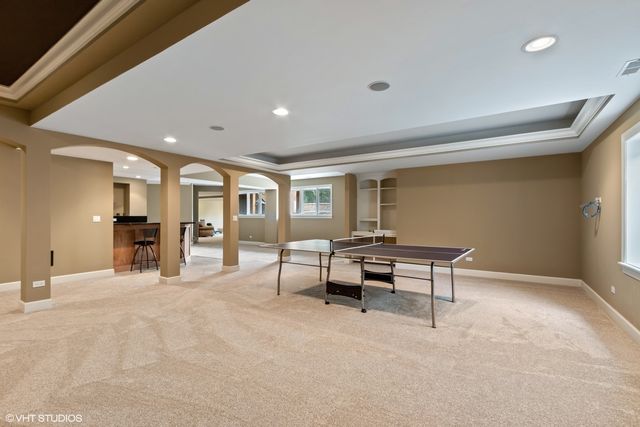 a view of a fireplace with window and a fireplace