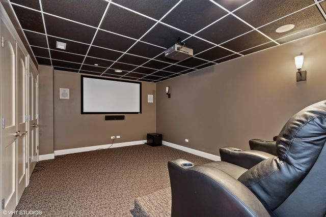 a bathroom with a granite countertop sink mirror a toilet and a vanity