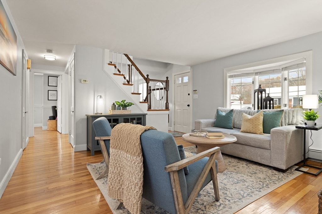 50 Forest Street Reading, MA 01867 - Photo 11 of 42 a living room with furniture and wooden floor