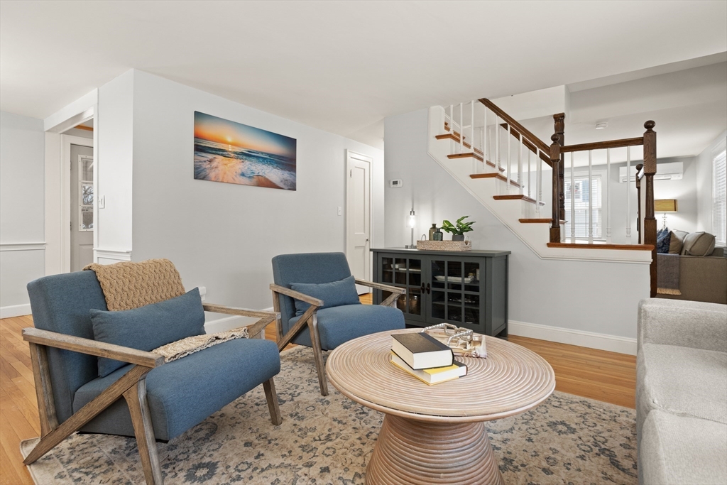 50 Forest Street Reading, MA 01867 - Photo 12 of 42 a living room with furniture and a table