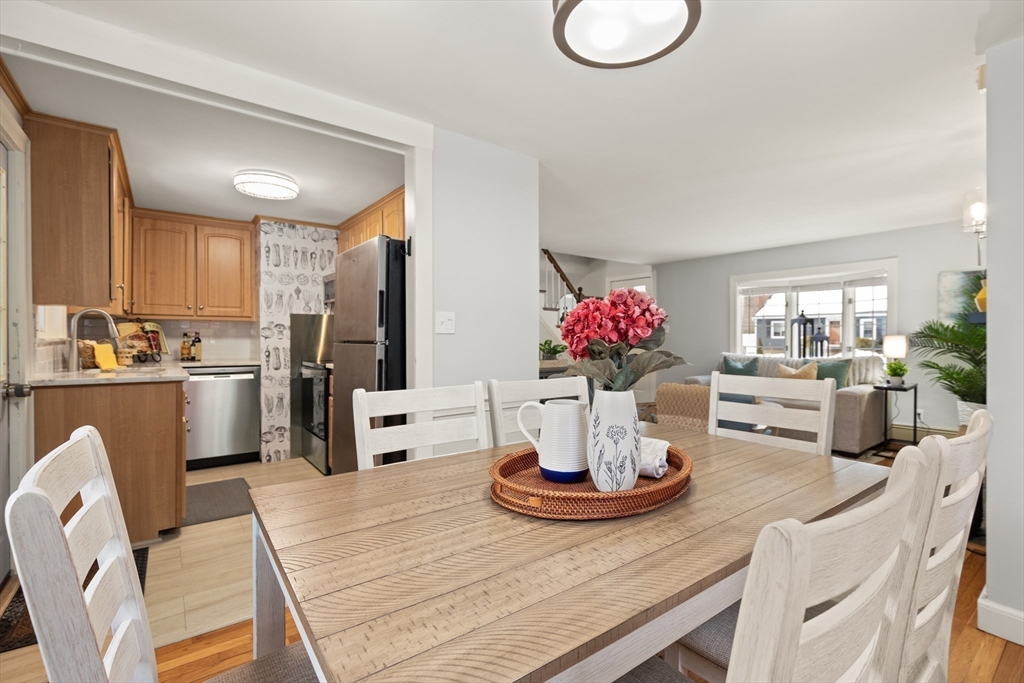 50 Forest Street Reading, MA 01867 - Photo 15 of 42 a kitchen with a dining table and chairs