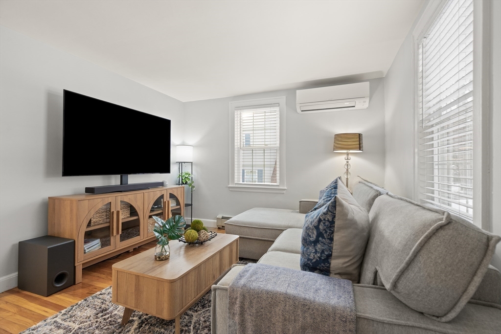 50 Forest Street Reading, MA 01867 - Photo 22 of 42 a living room with furniture and a flat screen tv