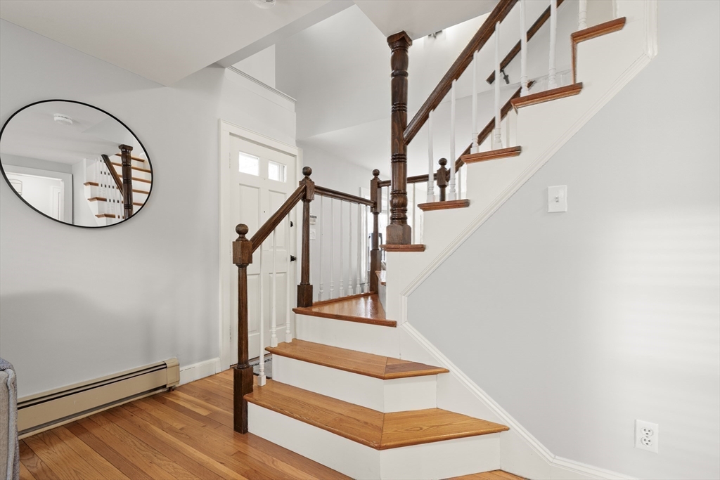 50 Forest Street Reading, MA 01867 - Photo 25 of 42 a view of entryway with wooden floor