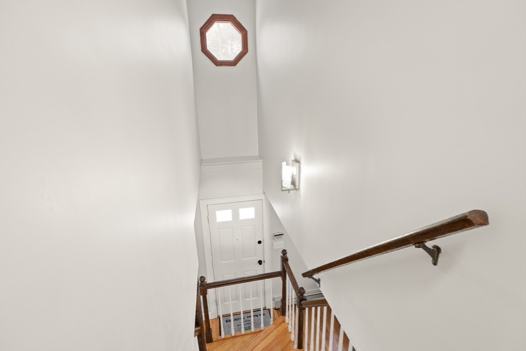 50 Forest Street Reading, MA 01867 - Photo 26 of 42 a view of a mirror with wooden floor