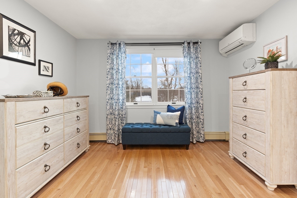 50 Forest Street Reading, MA 01867 - Photo 30 of 42 a living room with furniture and a dresser