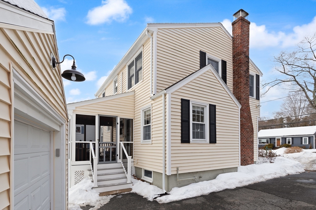 50 Forest Street Reading, MA 01867 - Photo 39 of 42 a view of a house with a door and stairs