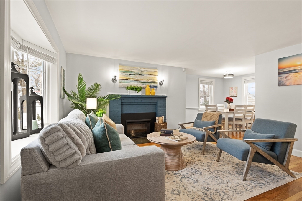 50 Forest Street Reading, MA 01867 - Photo 7 of 42 a living room with furniture a fireplace and a potted plant