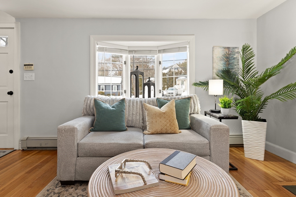 50 Forest Street Reading, MA 01867 - Photo 9 of 42 a living room with furniture and a large window