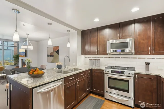 a kitchen with a refrigerator stove and microwave