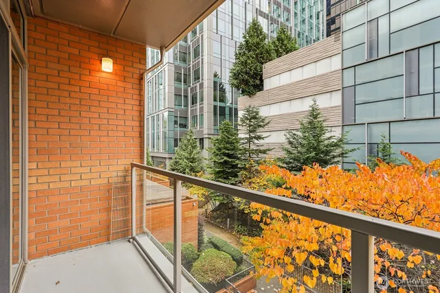 a view of balcony with wooden floor