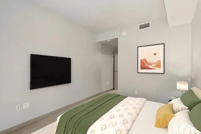 a view of walk in closet with living room