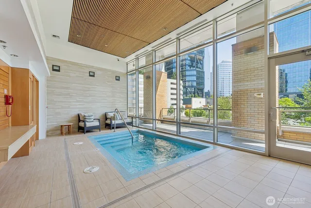 a row of palm trees in front of a building