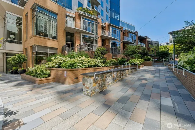 a street sign that is on a wooden wall