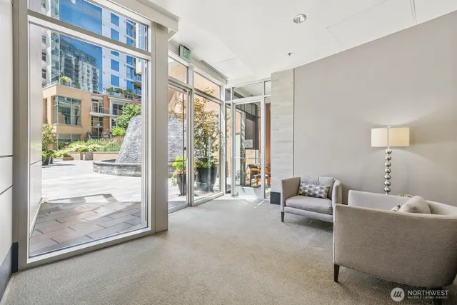 a living room with furniture and a large window