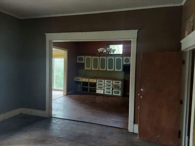 a view of empty room with a fireplace