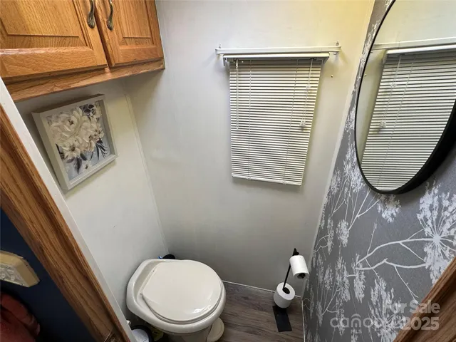 a bathroom with a toilet and a sink