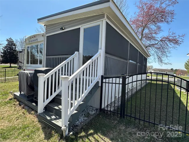 a view of a balcony with wooden floor