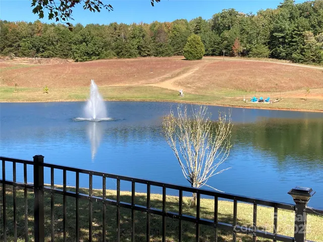 a view of a swimming pool with a yard