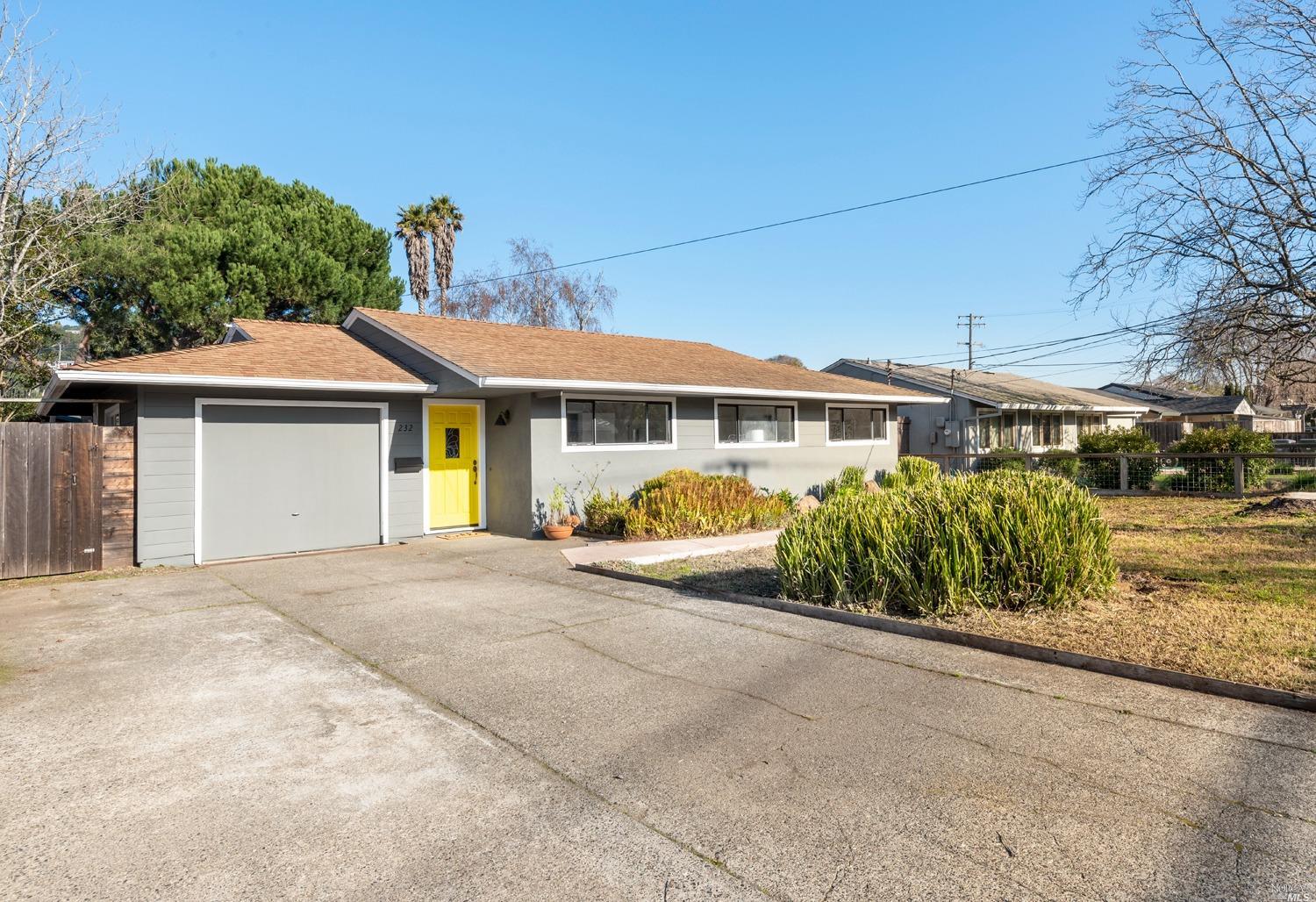 a view of a house with a large space in front of it