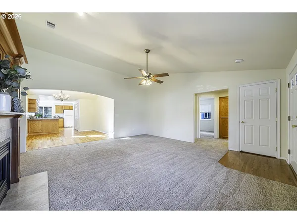 a view of an empty room with a fireplace